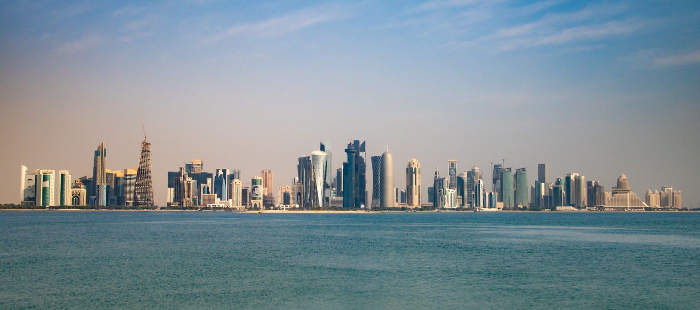 The Doha skyline from the Corniche under a clear sky