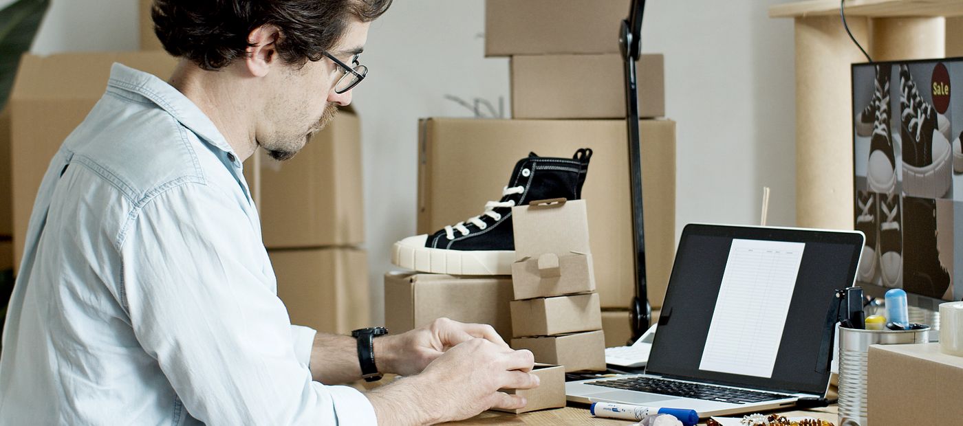 A worker preparing parcels for despatch