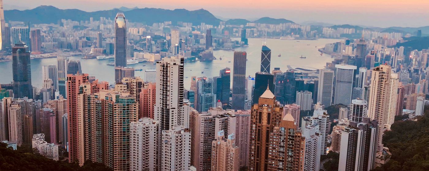 The Kowloon skyline and harbour at sunset