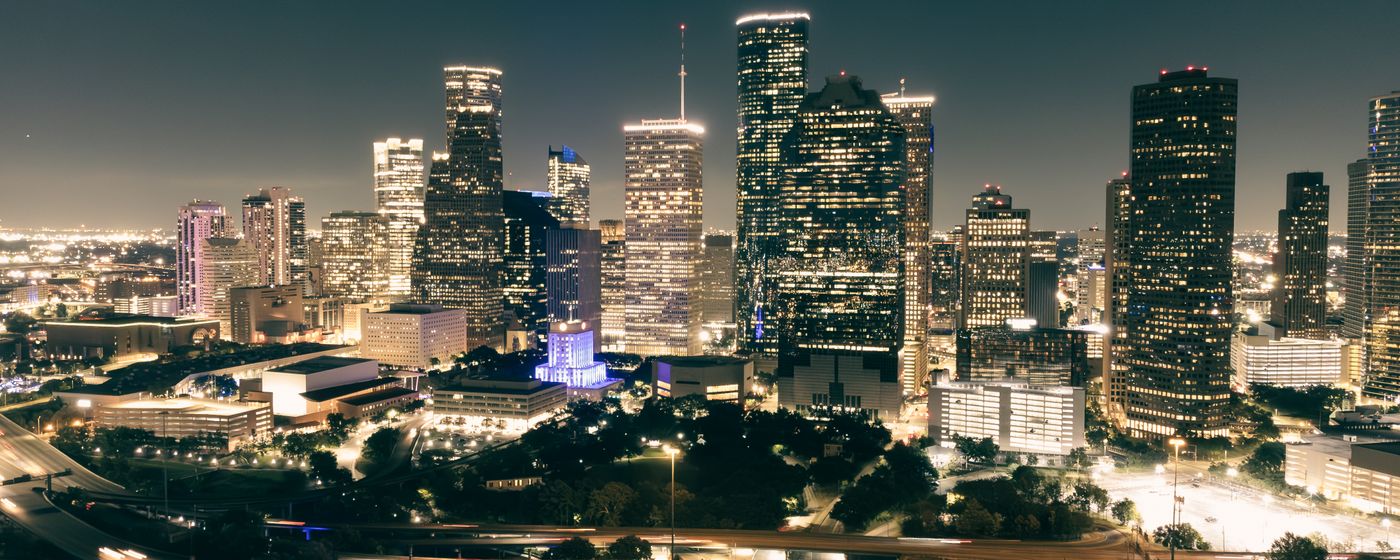 Illuminated skyscrapers and roads in downtown Houston at night
