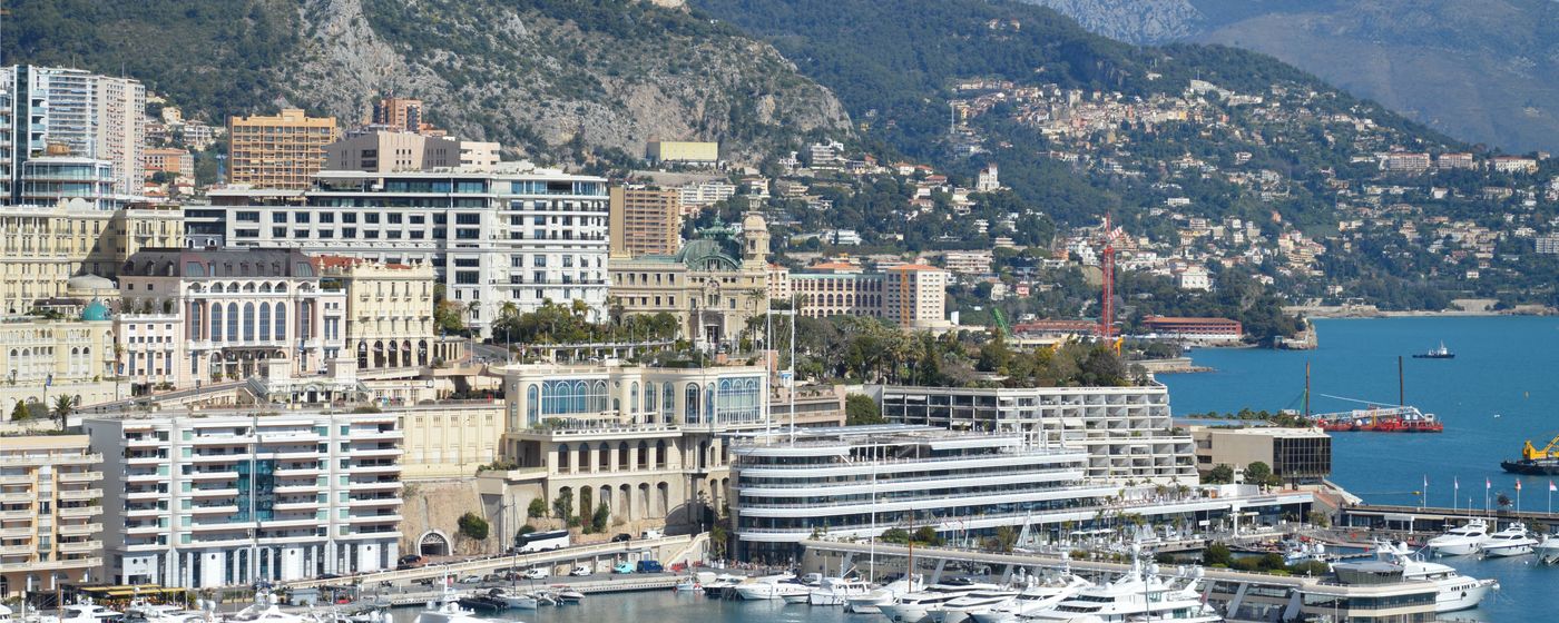The Monaco harbour and cityscape under a clear sky