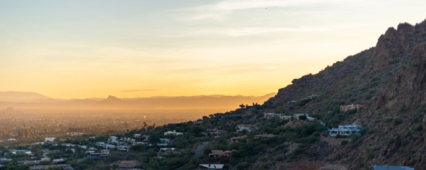 Phoenix at sunset, with the cityscape against desert hills