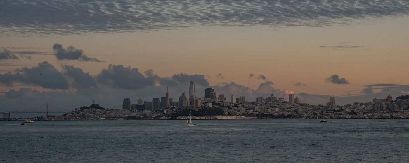 The San Francisco skyline across the water at dusk