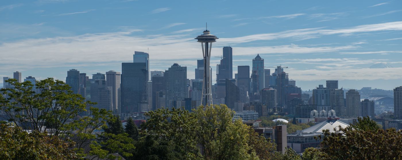 A panoramic view of Seattle with the Space Needle under a clear sky