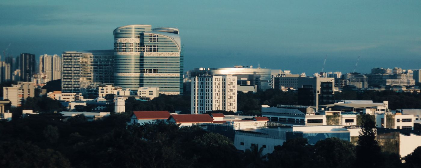 The Singapore skyline under a clear blue sky