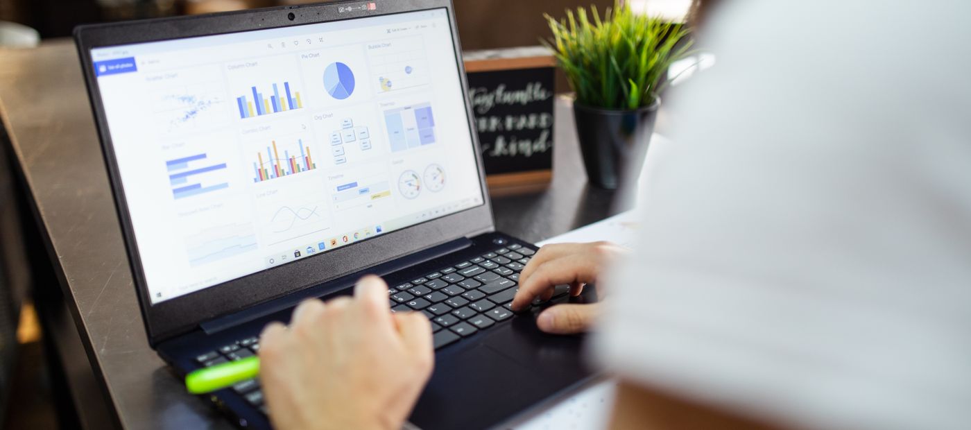 A laptop showing performance charts during a working session