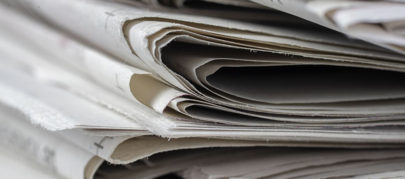 A close view of stacked newspapers